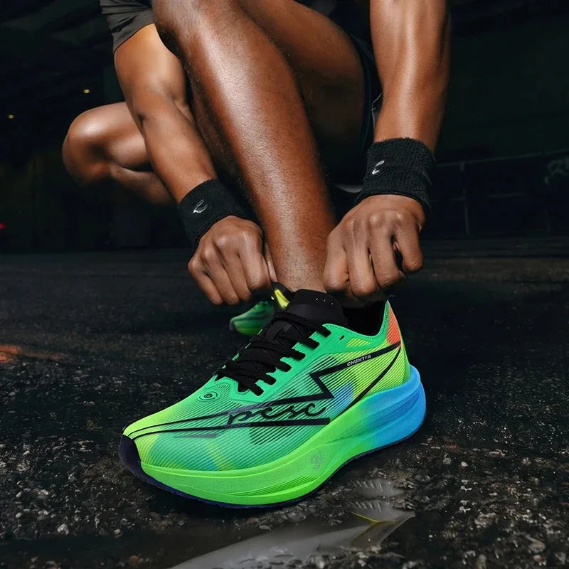 Runner lacing up neon green running shoes on wet asphalt